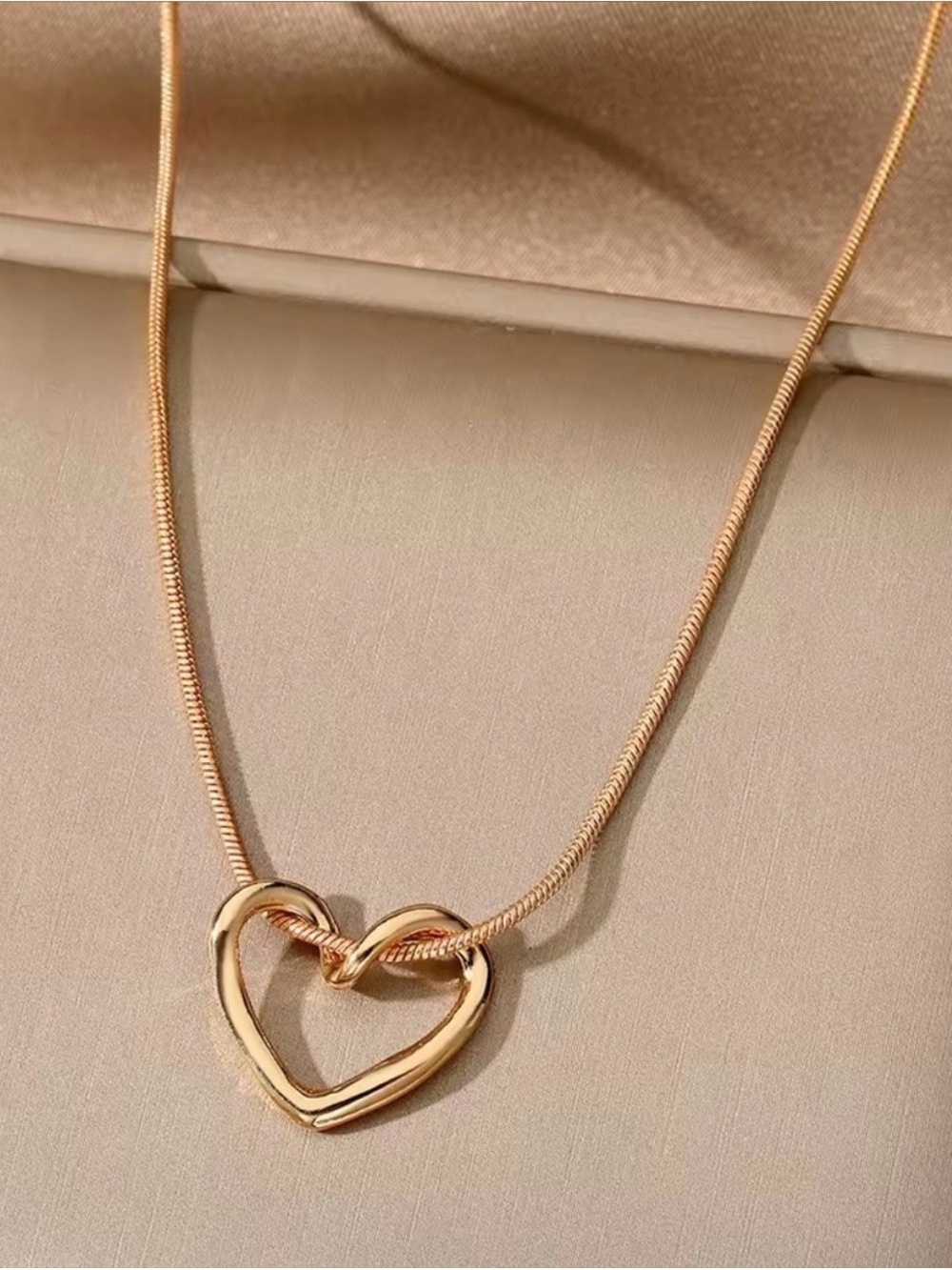 Polished Gold Heart Knot Necklace